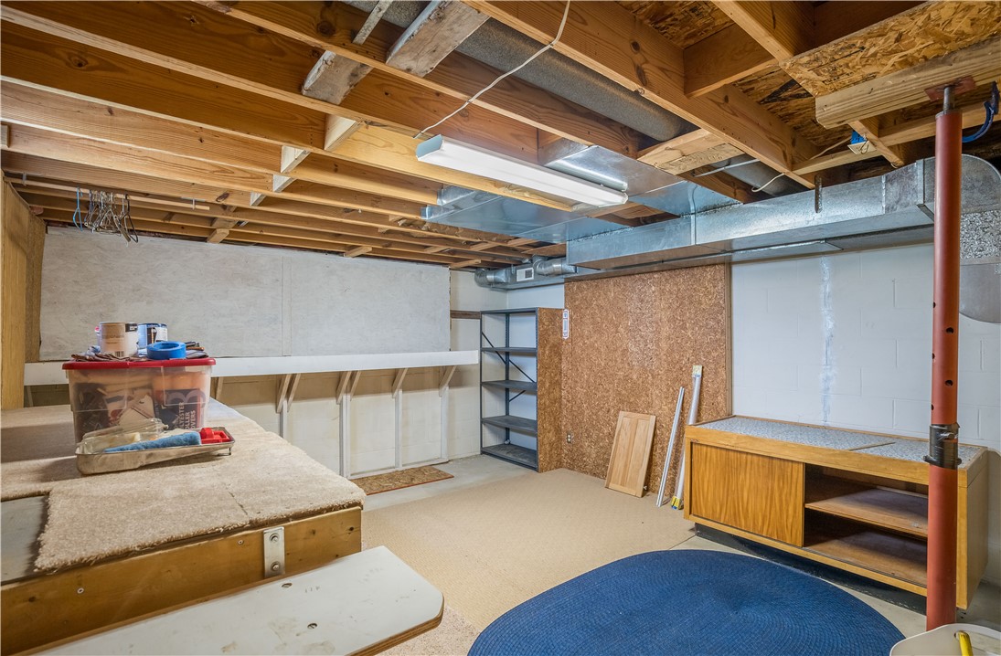 1319 Perry Road Cable, OH 43009 - Photo 29 of 44 This spacious unfinished basement offers ample storage and potential for future customization.