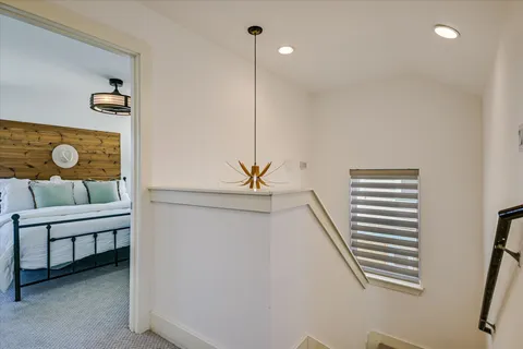 a bedroom with furniture and a window