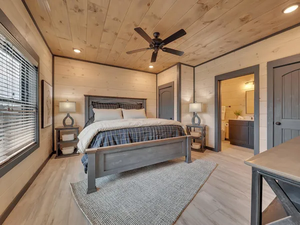 a bathroom with a double vanity sink toilet and shower