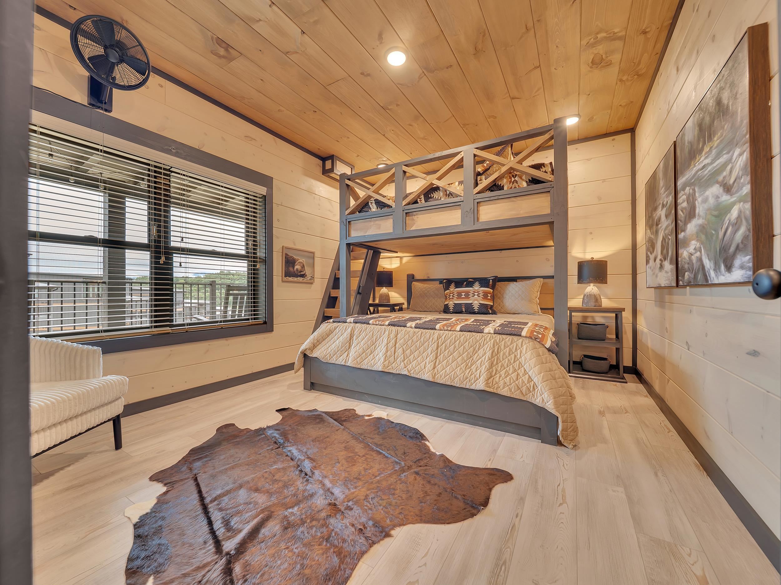 1319 Wildhorse Ridge Way, Unit LOT 143R Sevierville, TN 37862 - Photo 20 of 39 a bed room with a bed and a large window