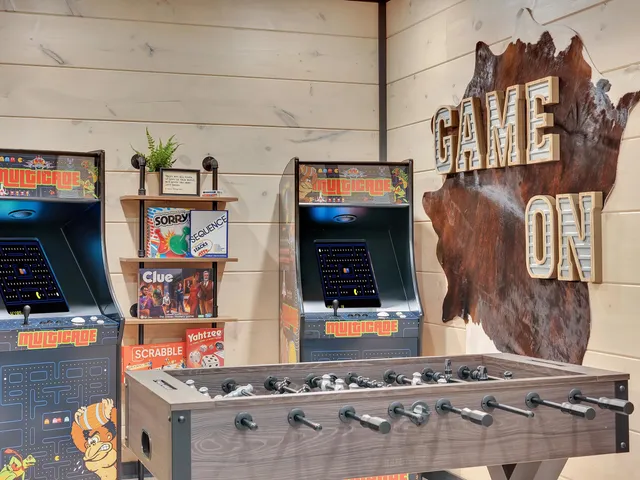 a living room with lots of furniture and a chandelier