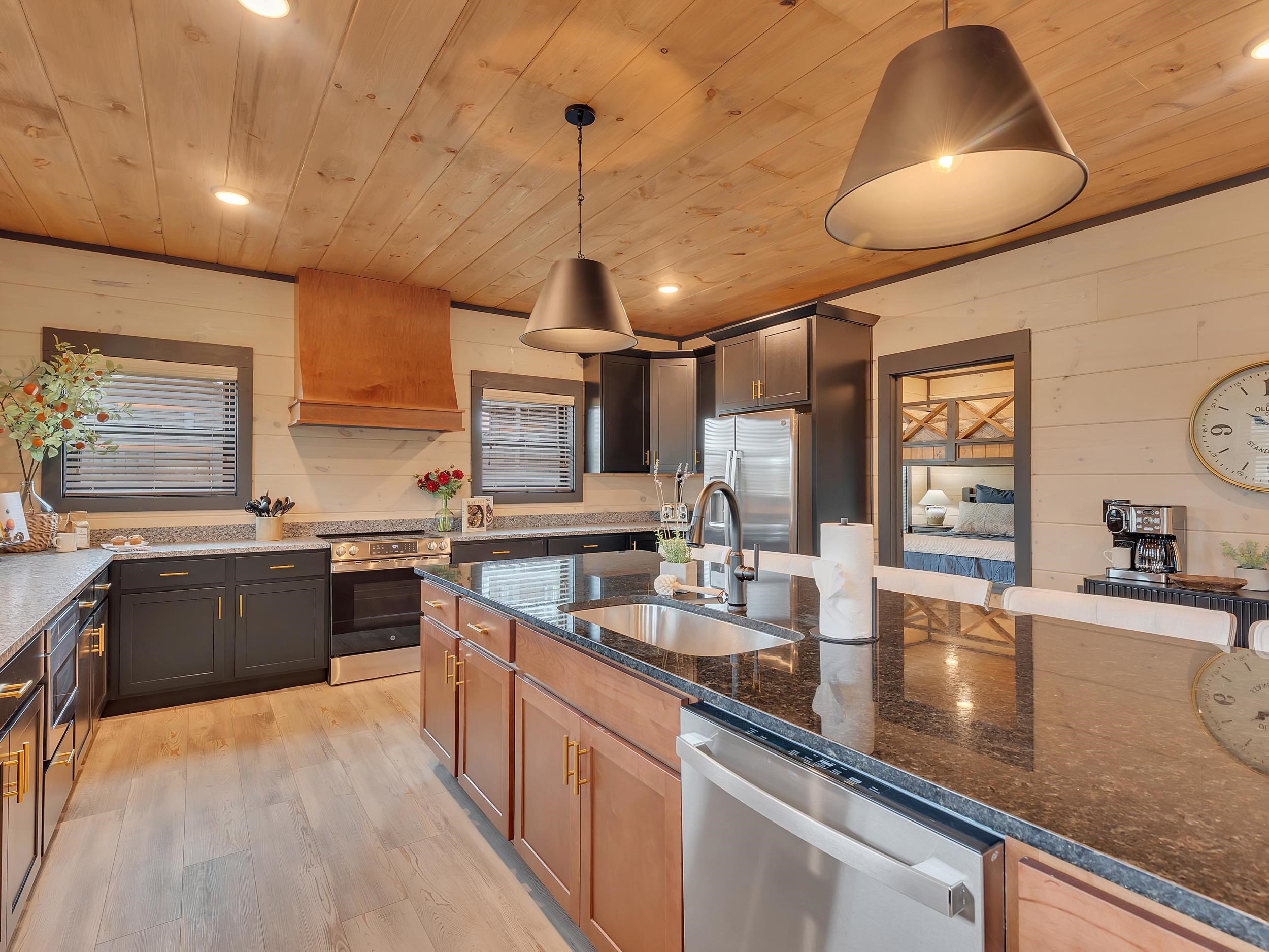 1319 Wildhorse Ridge Way, Unit LOT 143R Sevierville, TN 37862 - Photo 3 of 39 a large kitchen with stainless steel appliances granite countertop a lot of counter space and a sink