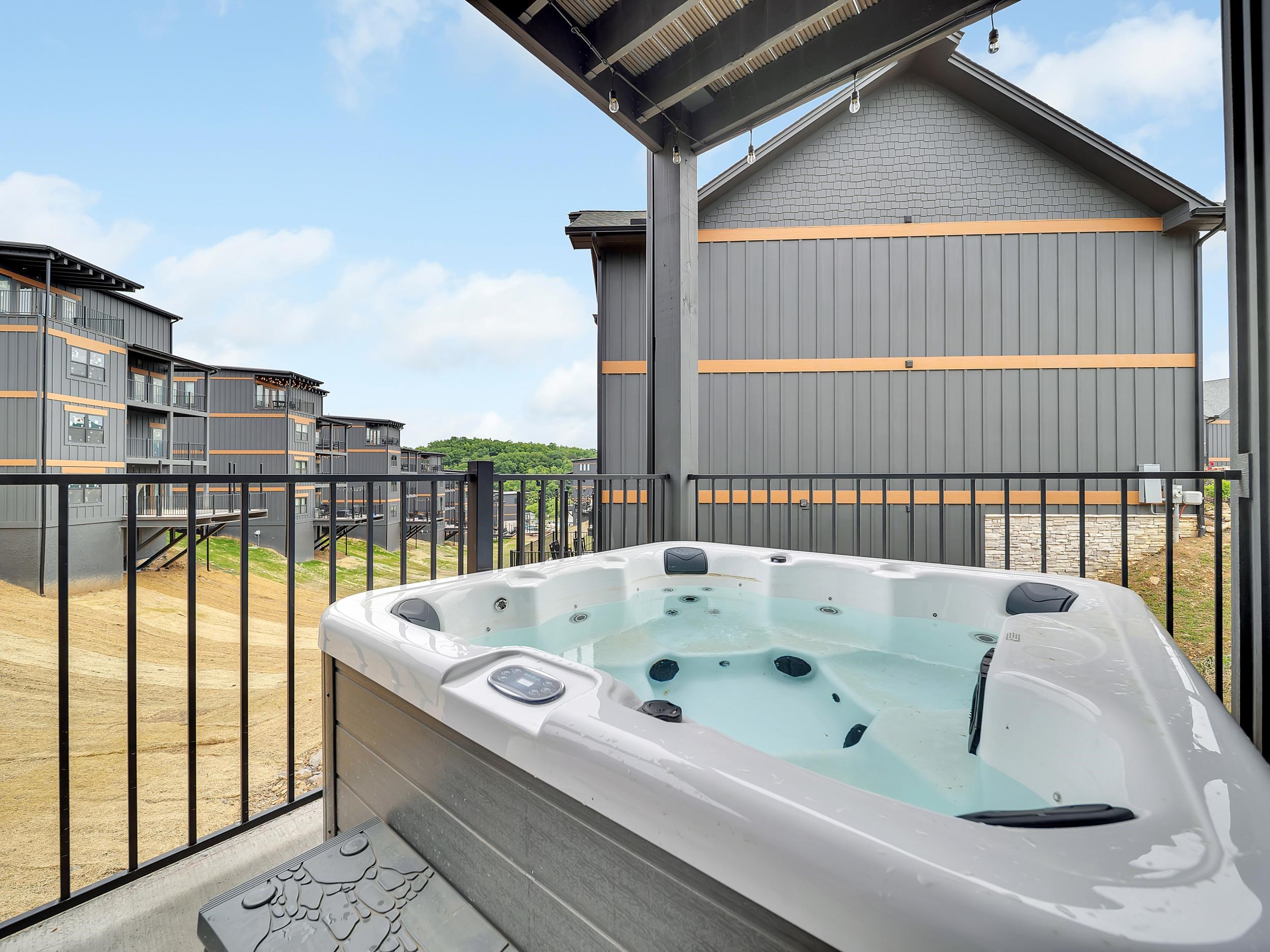 1319 Wildhorse Ridge Way, Unit LOT 143R Sevierville, TN 37862 - Photo 32 of 39 a bath tub sitting next to a window