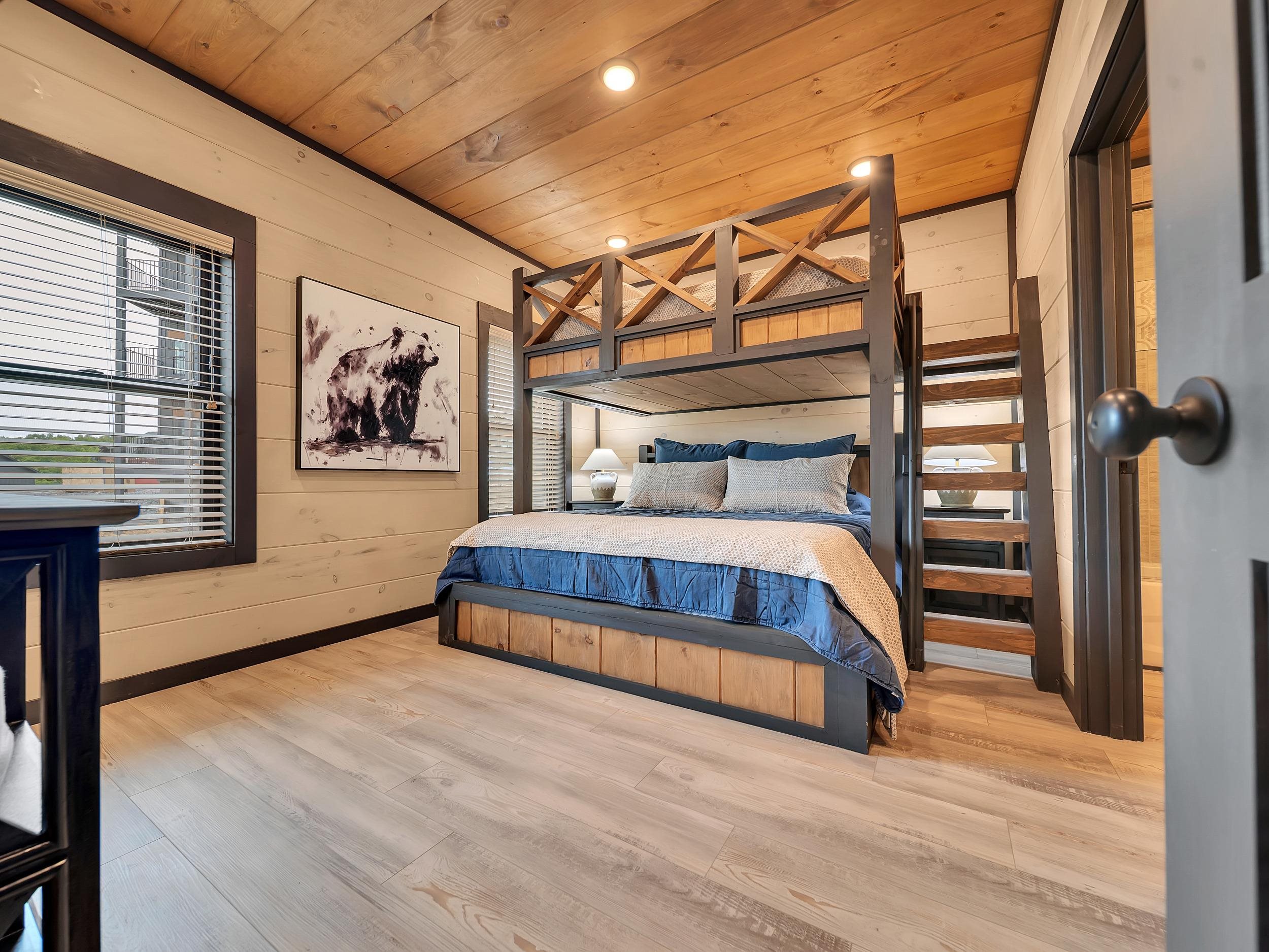 1319 Wildhorse Ridge Way, Unit LOT 143R Sevierville, TN 37862 - Photo 9 of 39 a bedroom with a bed and a painting on the wall