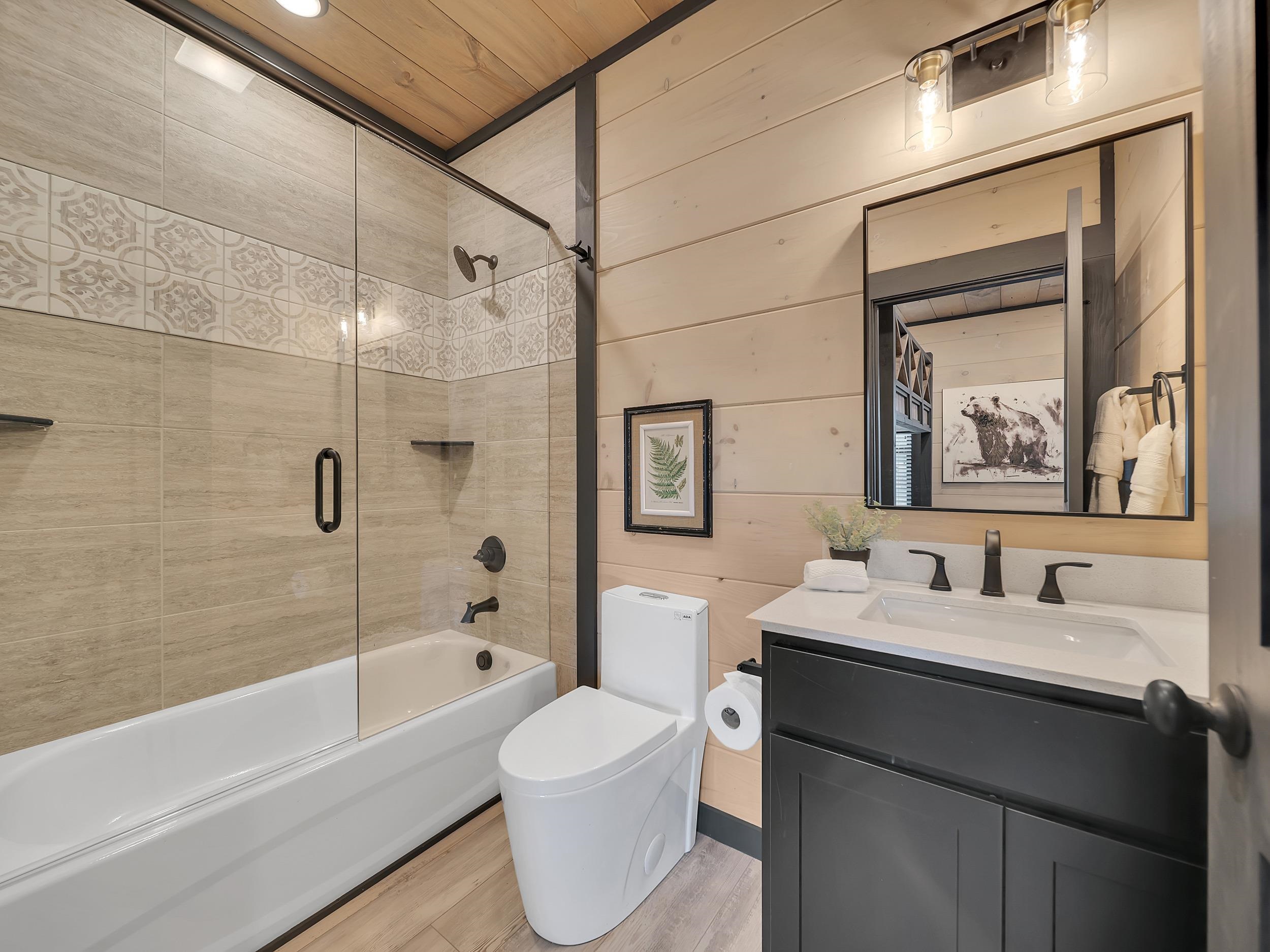 1319 Wildhorse Ridge Way, Unit LOT 143R Sevierville, TN 37862 - Photo 10 of 39 a bathroom with a sink toilet tub and shower