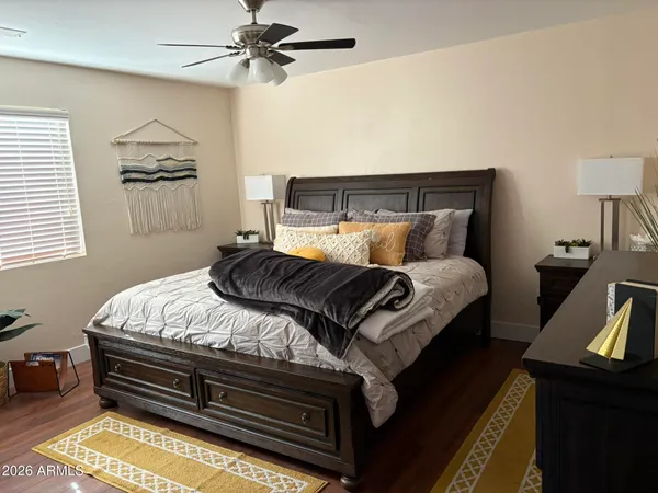 a bedroom with bed and window