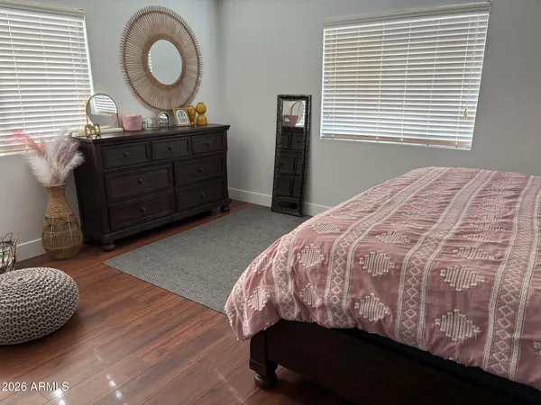 a bedroom with a bed and window