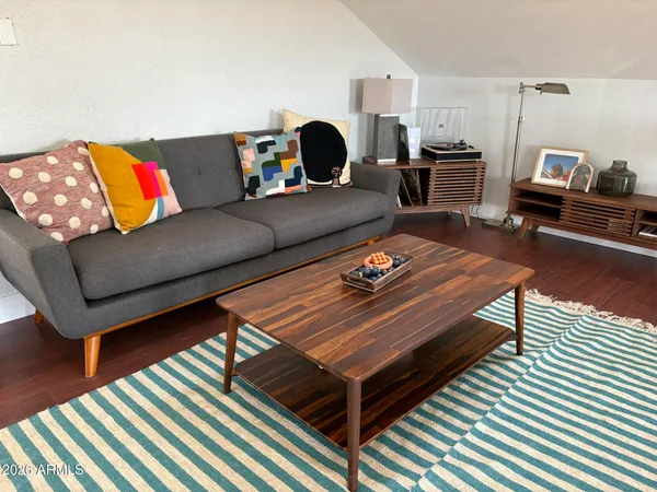 a living room with furniture a rug and a couch