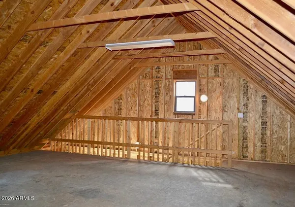 a view of a brick house with a small yard