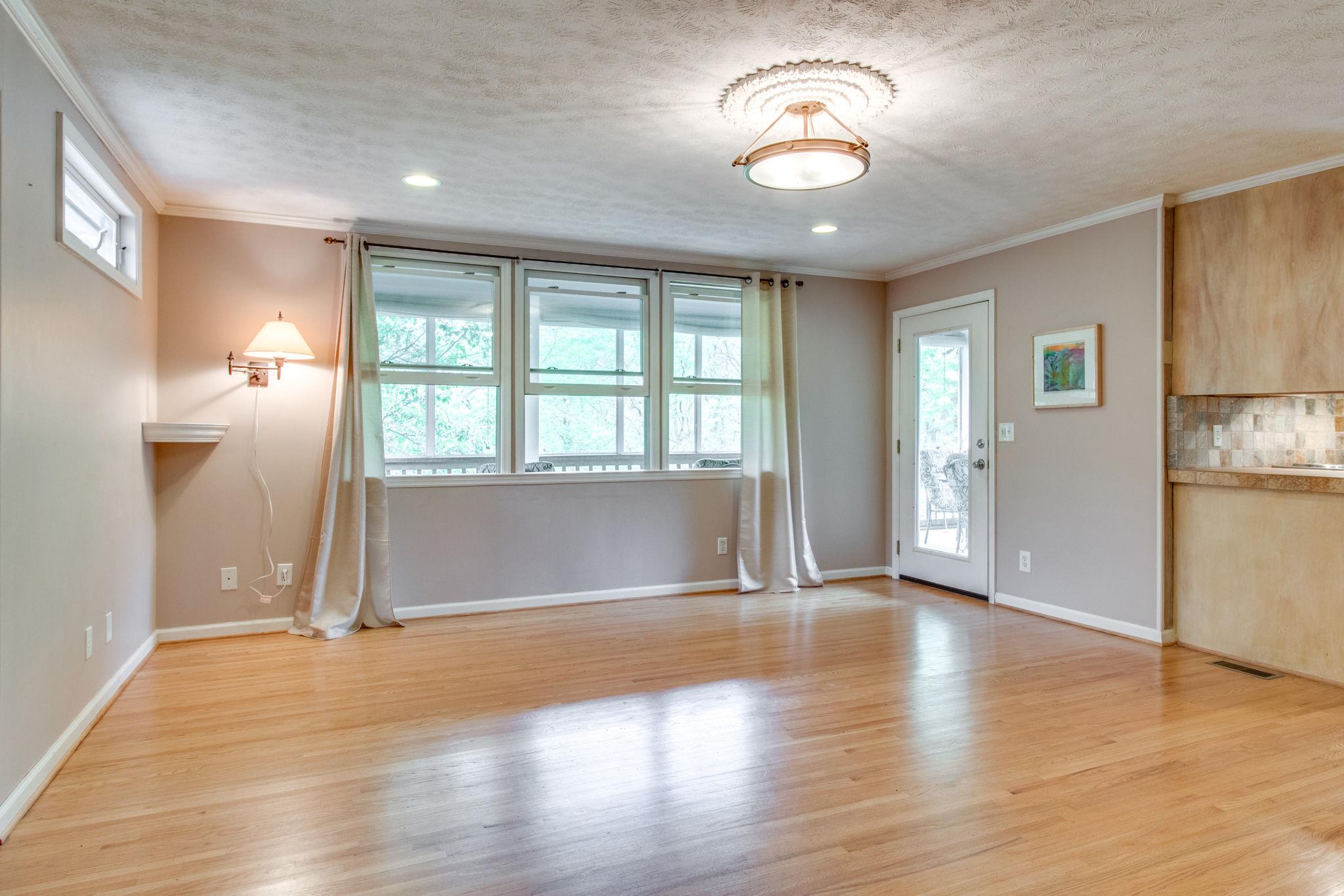 711 Starlit Road Nashville, TN 37205 - Photo 8 of 21 Room enough to add an informal eating area in family room near the bank of windows looking out on wooded lot