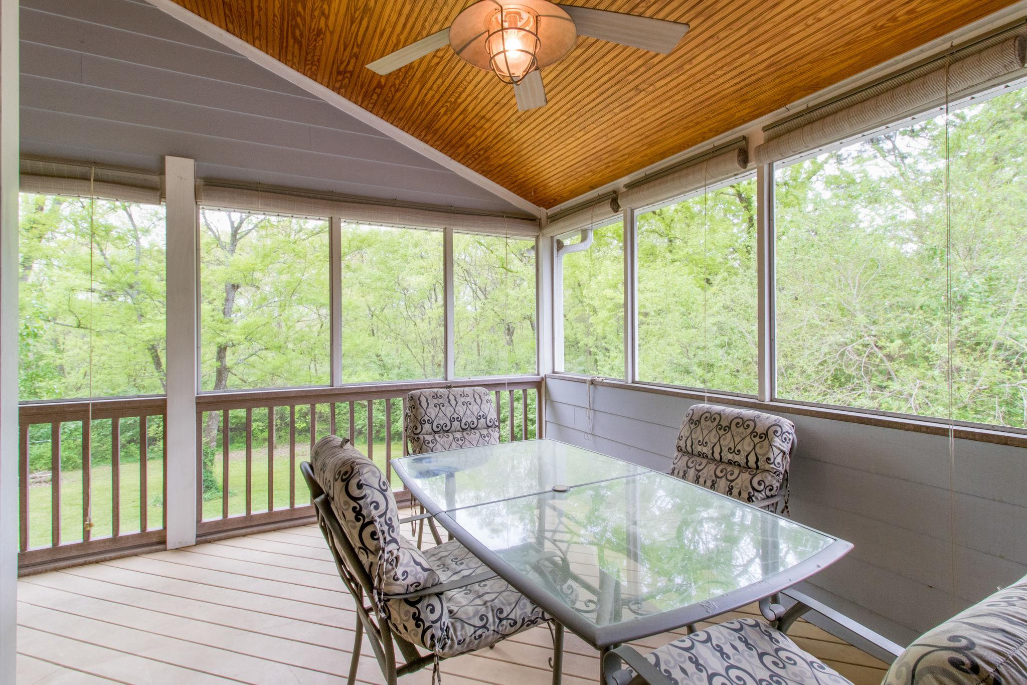 711 Starlit Road Nashville, TN 37205 - Photo 9 of 21 Upstairs screened porch with vaulted ceiling and fan