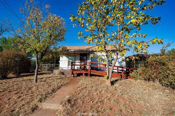 a view of a outdoor space with porch and sitting area