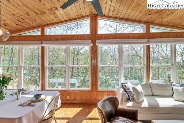 a living room with furniture and windows