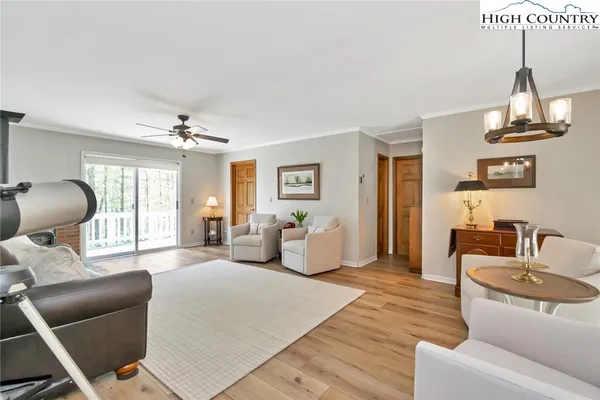 a bedroom with furniture and a large window