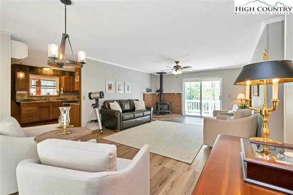 a living room with furniture fireplace and flat screen tv