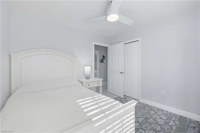 a large white bed in a white room