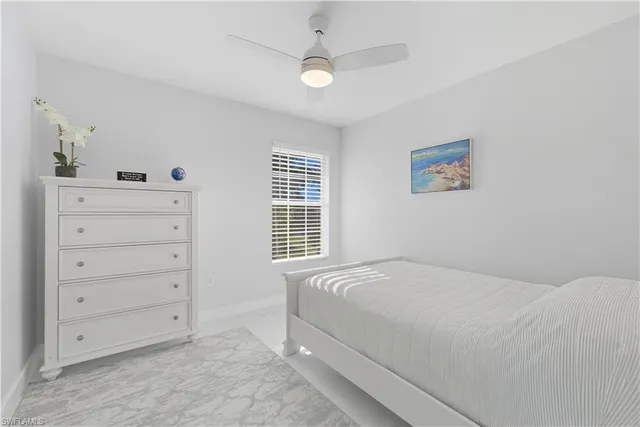 a bedroom with a bed and a cabinets