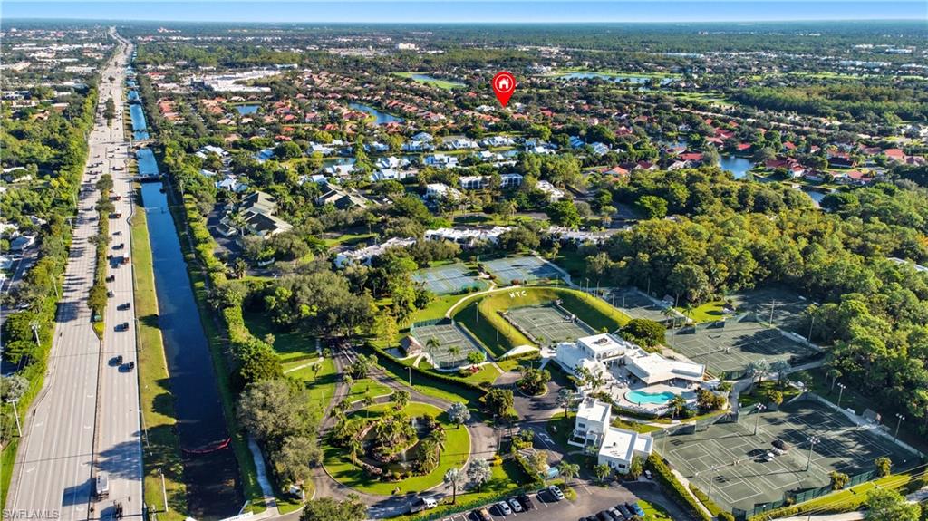 3605 Corinthian Way Naples, FL 34105 - Photo 30 of 34 an aerial view of a residential houses with outdoor space and street view