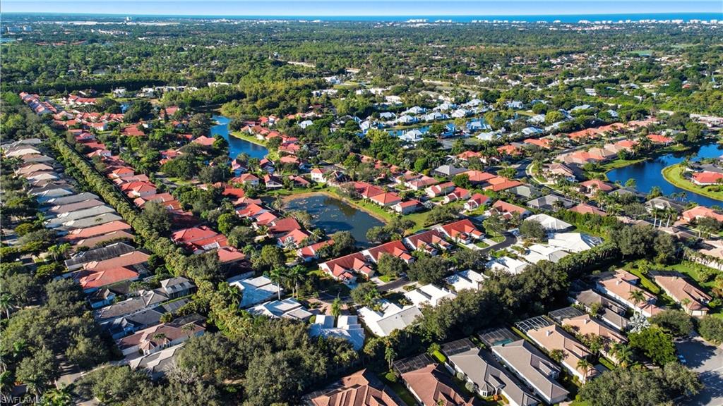 3605 Corinthian Way Naples, FL 34105 - Photo 33 of 34 an aerial view of city and lake