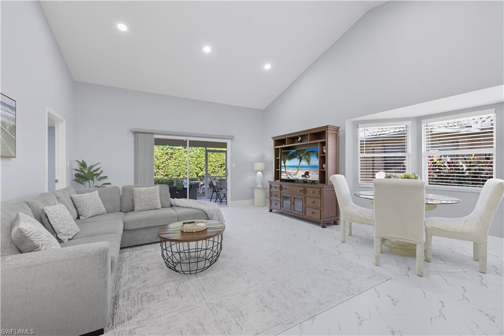 3605 Corinthian Way Naples, FL 34105 - Photo 4 of 34 a living room with furniture and a flat screen tv