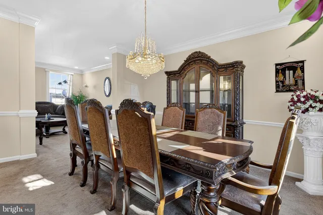 a kitchen with stainless steel appliances granite countertop a refrigerator a stove and a sink with wooden floor