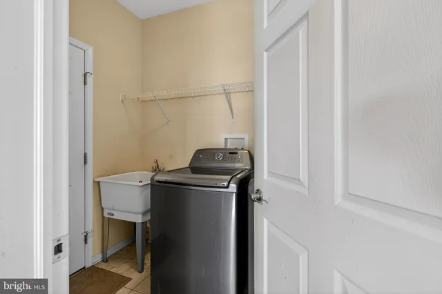 a bedroom with a bed and couch