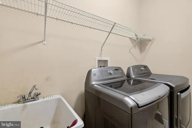 a living room with a couch and a window