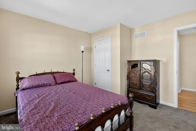 a bathroom with a granite countertop sink a mirror and a vanity