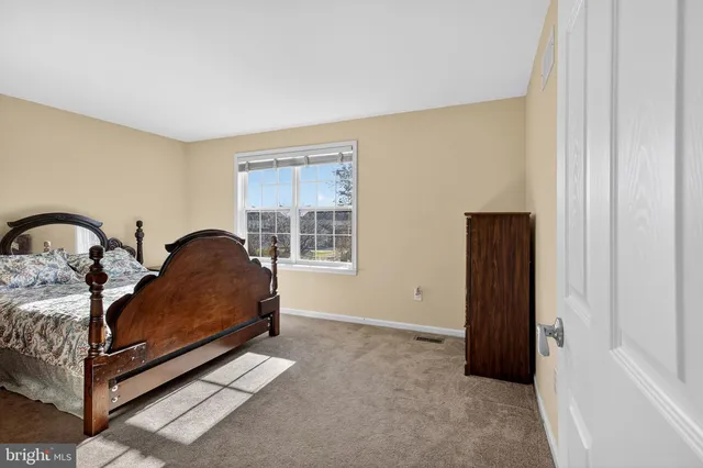 a living room with furniture and large window