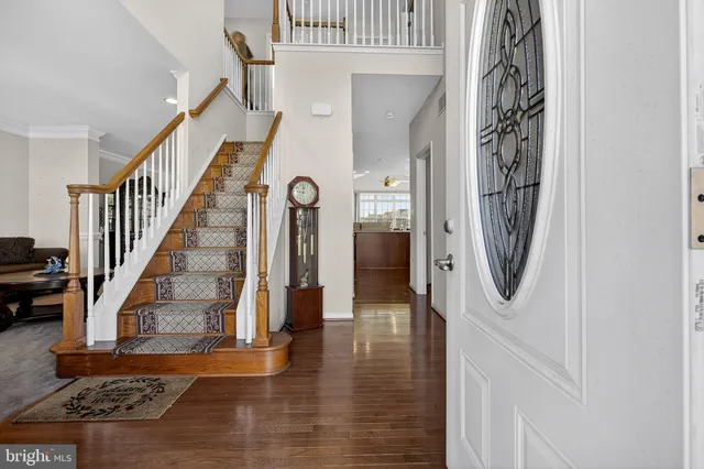 a living room with furniture a rug and a window