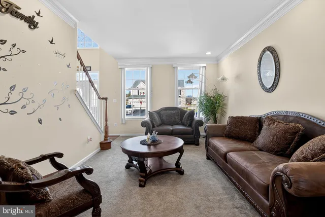 a kitchen with stainless steel appliances granite countertop a sink refrigerator and cabinets
