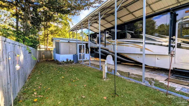 a view of a balcony with chairs and potted plants