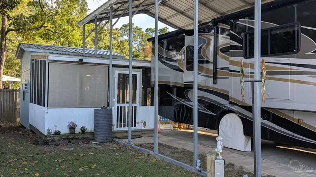 a view of a backyard with a patio and a garden