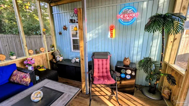 a view of a bedroom with furniture and a potted plant