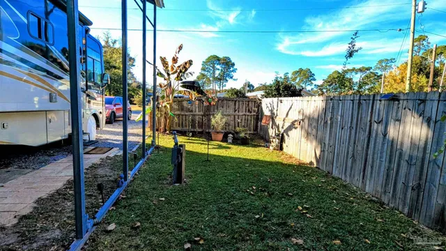 a view of outdoor space and wooden deck