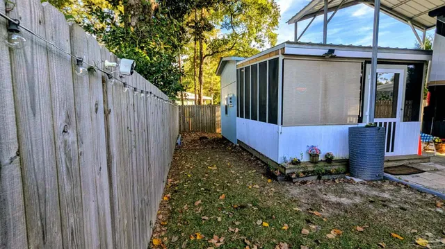a view of a backyard with sitting area