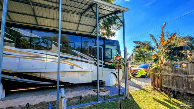 a view of a park with plants and a bench