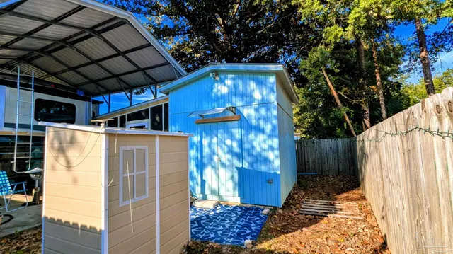 a view of a swimming pool with an outdoor space and seating area
