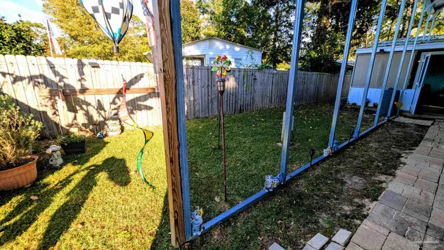 a view of a swimming pool with a yard