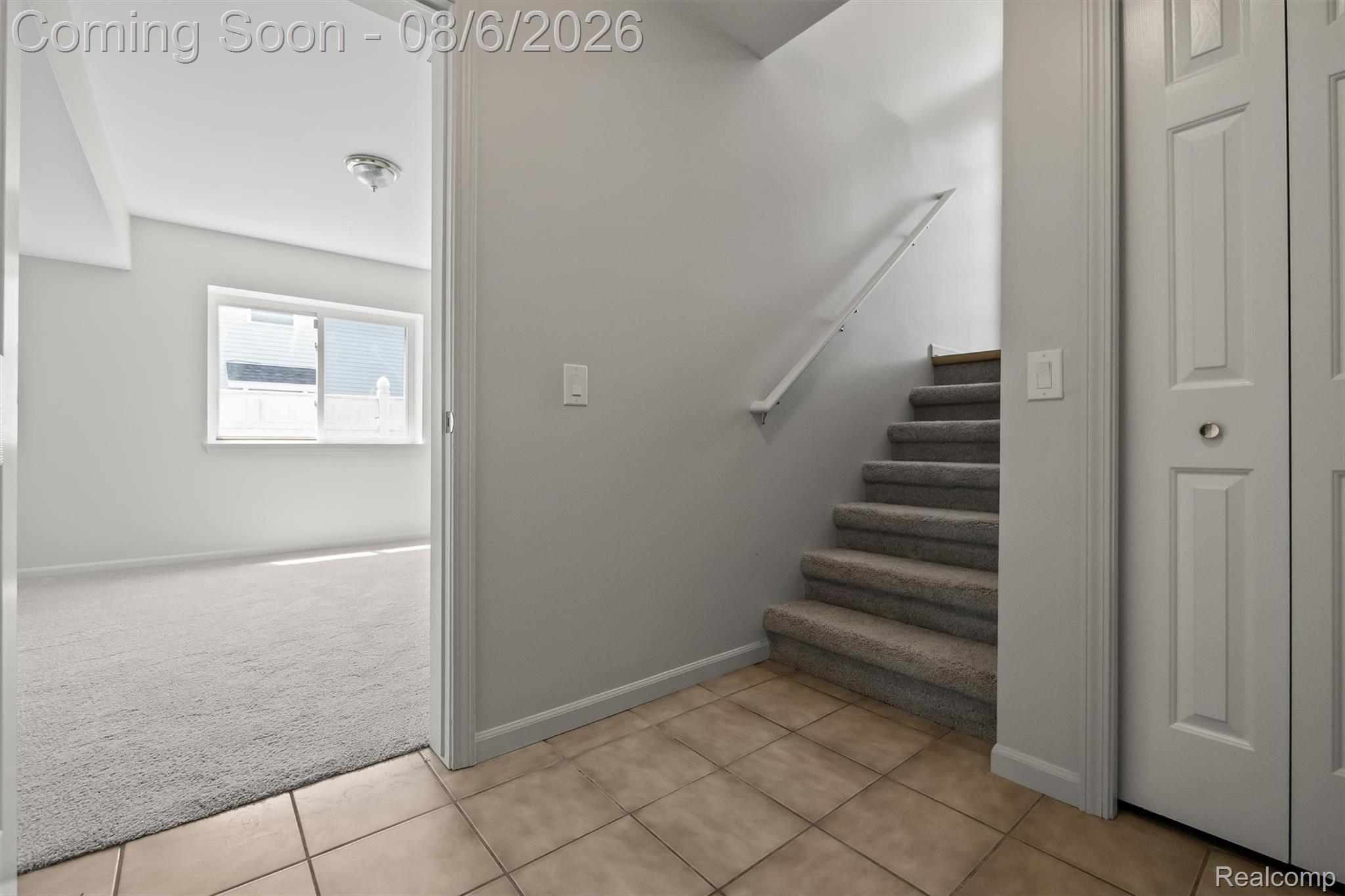 4427 Hannan Road Wayne, MI 48184 - Photo 20 of 33 Welcoming entryway featuring neutral-toned walls, ceramic tile flooring, and direct staircase access
