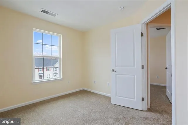 a view of empty room with windows