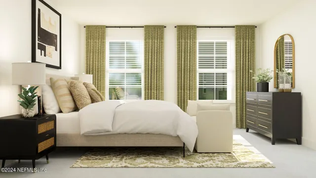 a bedroom with a bed and a painting on the wall