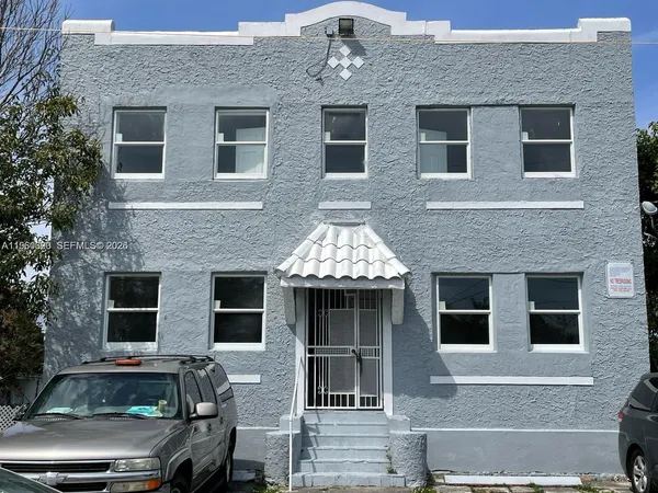 a front view of a house with parking