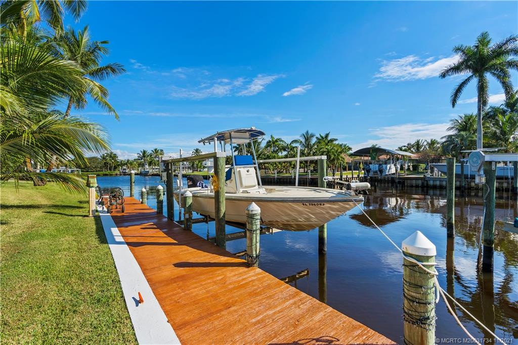1996 Northwest Fork Road Stuart, FL 34994 - Photo 46 of 59 a view of a swimming pool with a patio and dining room