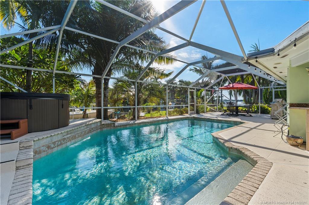 1996 Northwest Fork Road Stuart, FL 34994 - Photo 52 of 59 a view of a swimming pool with a patio
