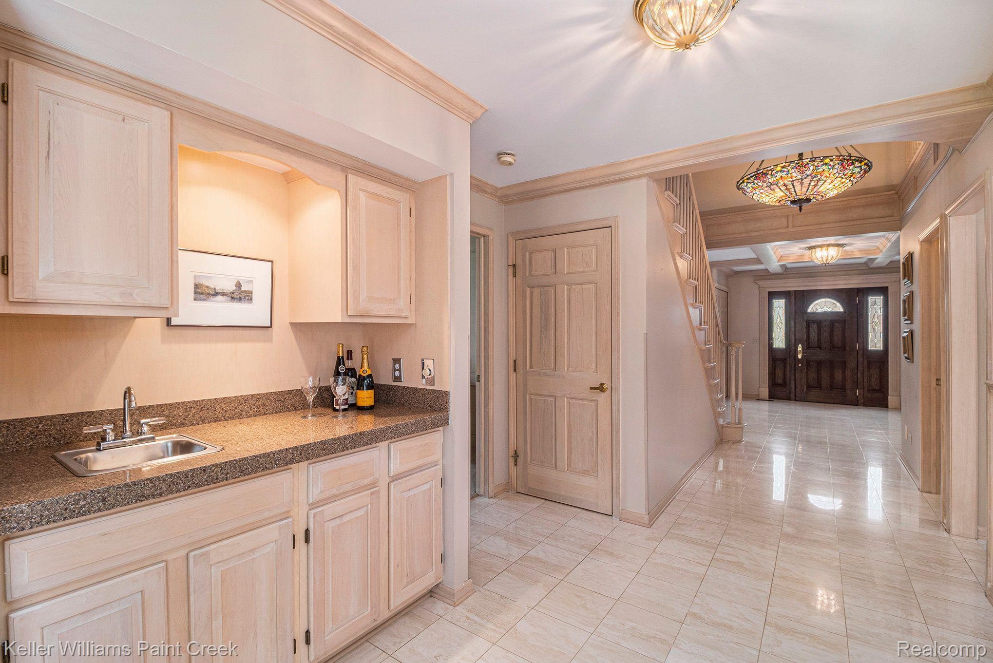 1817 Apple Ridge Court Rochester, MI 48306 - Photo 13 of 36 Wet bar with sink and good storage.