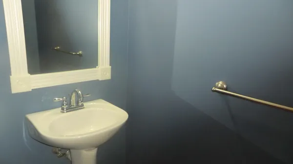 a bathroom with a sink and mirror