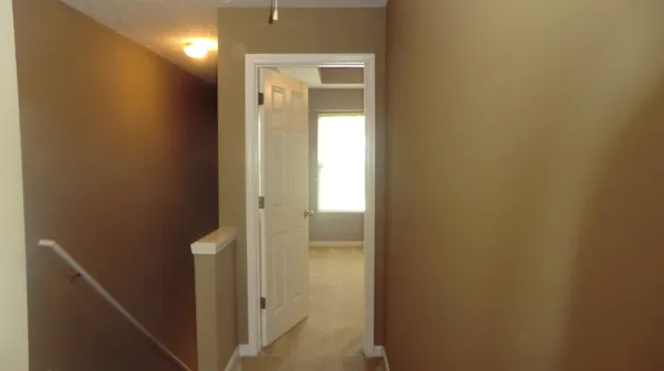 a view of a patio with table and chairs and potted plants