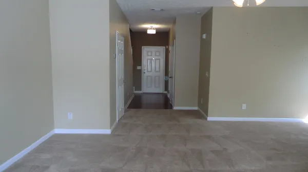 an empty room with entrance and door