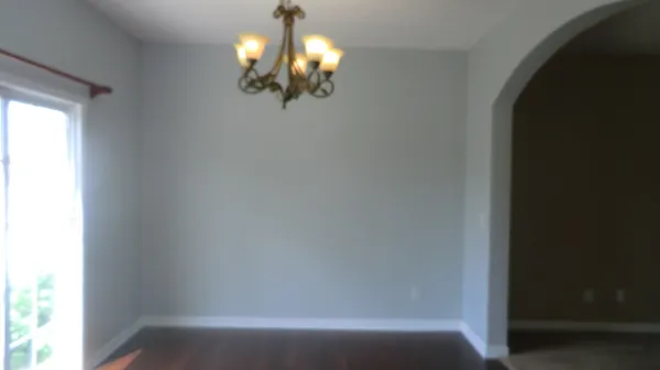 a view of a chandelier in big room